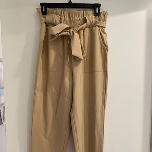 Beige trousers with tie knot